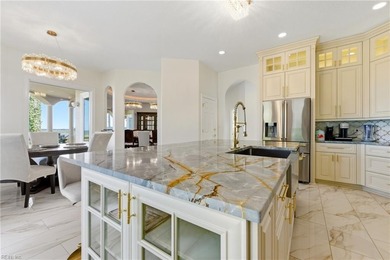 Welcome to this exquisite Spanish-style waterfront estate which