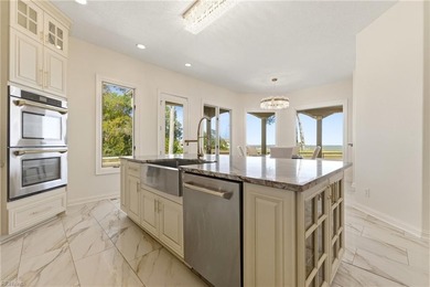 Welcome to this exquisite Spanish-style waterfront estate which