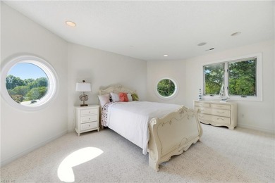 Welcome to this exquisite Spanish-style waterfront estate which