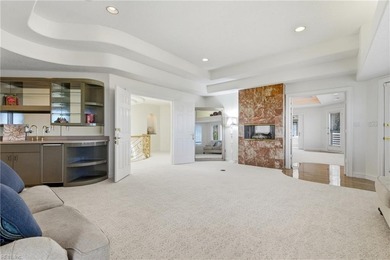 Welcome to this exquisite Spanish-style waterfront estate which