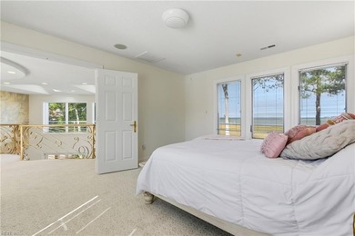 Welcome to this exquisite Spanish-style waterfront estate which