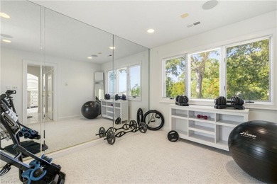 Welcome to this exquisite Spanish-style waterfront estate which