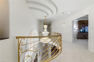 Welcome to this exquisite Spanish-style waterfront estate which