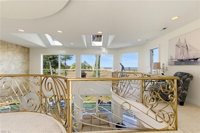 Welcome to this exquisite Spanish-style waterfront estate which