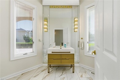 Welcome to this exquisite Spanish-style waterfront estate which