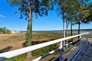 Welcome to this exquisite Spanish-style waterfront estate which