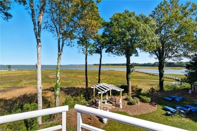 Welcome to this exquisite Spanish-style waterfront estate which