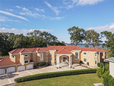 Welcome to this exquisite Spanish-style waterfront estate which