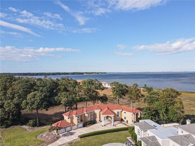 Welcome to this exquisite Spanish-style waterfront estate which