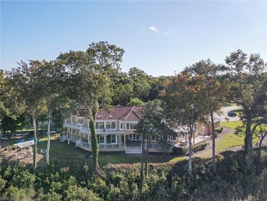 Welcome to this exquisite Spanish-style waterfront estate which