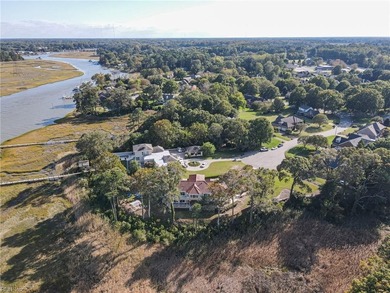 Welcome to this exquisite Spanish-style waterfront estate which