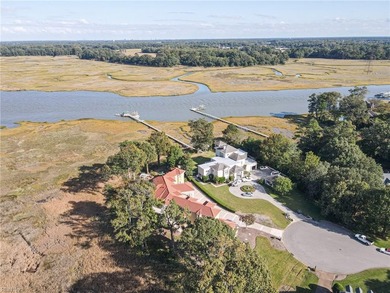 Welcome to this exquisite Spanish-style waterfront estate which