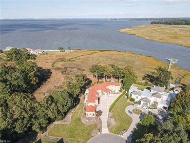 Welcome to this exquisite Spanish-style waterfront estate which