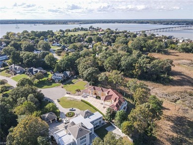 Welcome to this exquisite Spanish-style waterfront estate which