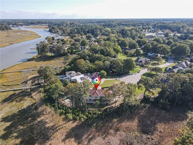 Welcome to this exquisite Spanish-style waterfront estate which