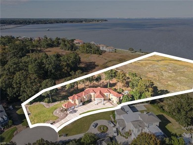 Welcome to this exquisite Spanish-style waterfront estate which