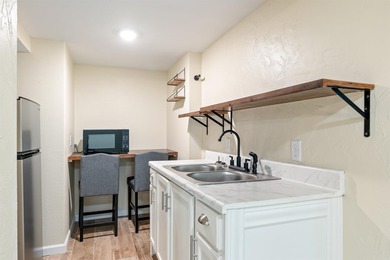 This home has been totally rebuilt...NEW roof, NEW electrical - photo 39