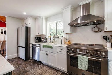 Thoughtfully and extensively renovated, this timeless farmhouse - photo 3