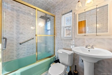 Welcome home to this inviting brick semi-attached single-family - photo 15