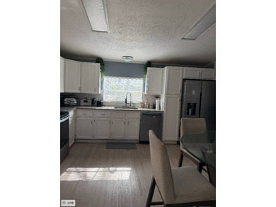 Lot rent is currently $1,040 This is a well kept double wide. As - photo 3