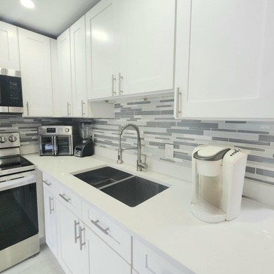 Spectacular renovated 1st floor condo in the active 55 community - photo 2