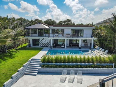 Set on one third of an acre with 90 feet of seawall just off the - photo 7