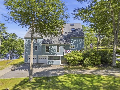 Nestled along the shore of the Kennebec River, this private 3BR - photo 2