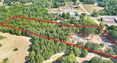 Over 5 acres waiting to be developed! Situated within minutes of - photo 4