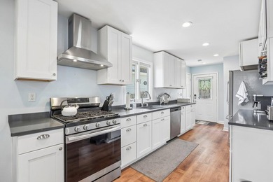 Presenting the Lake Home you've been waiting for! Renovated from - photo 2