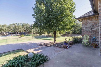 This cozy Medicine Park home has it all: Serene views of the - photo 7