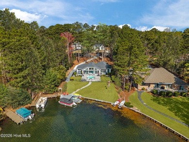 Welcome to this custom lakefront home on Lake Auman, where the - photo 3