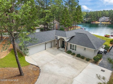 Welcome to this custom lakefront home on Lake Auman, where the - photo 5