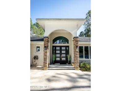 Welcome to this custom lakefront home on Lake Auman, where the - photo 8