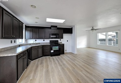 Tastefully updated and move-in ready, this bright home features