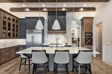Experience refined mountain living in this custom-built - photo 35