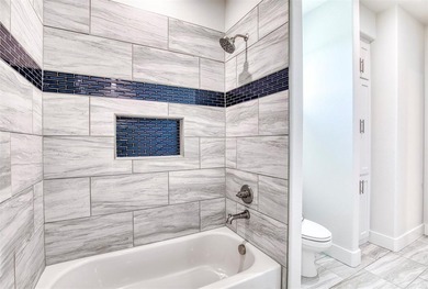 This stunning custom-built home presents a striking blend of - photo 22