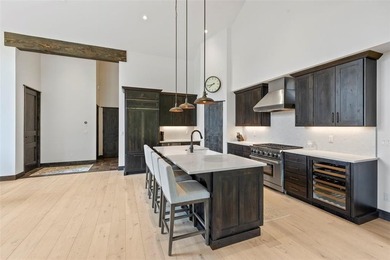 This immaculately maintained riverfront mountain residence is - photo 8
