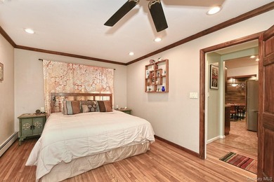 Charming Center-Hall Cape Cod Nestled on Serene Tree-Lined - photo 16