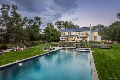 Set on the tranquil shores of Genet Creek, this modern - photo 3