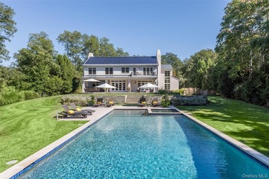 Set on the tranquil shores of Genet Creek, this modern - photo 4