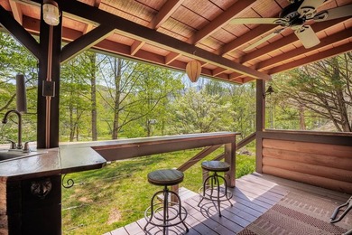 Set on 27.4 acres of rolling pasture and mountain-view land, 440 - photo 31