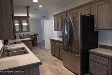 Welcome home to this charming 3-bedroom, 2-bath residence in the - photo 2