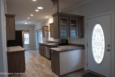 Welcome home to this charming 3-bedroom, 2-bath residence in the - photo 3