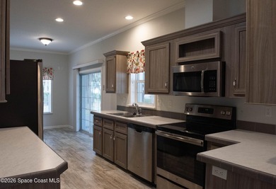 Welcome home to this charming 3-bedroom, 2-bath residence in the - photo 4