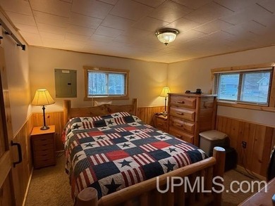 Experience true Northwoods living with this charming waterfront - photo 14
