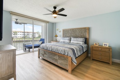 Wake up to panoramic water views from this beautifully - photo 13