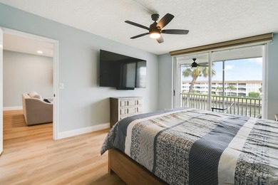 Wake up to panoramic water views from this beautifully - photo 14