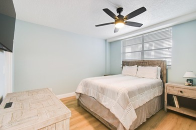 Wake up to panoramic water views from this beautifully - photo 22