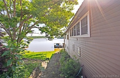Originally a Quonset hut, this unique lakefront property blends - photo 35