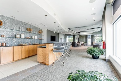 This unique condo offers open-concept living with direct access